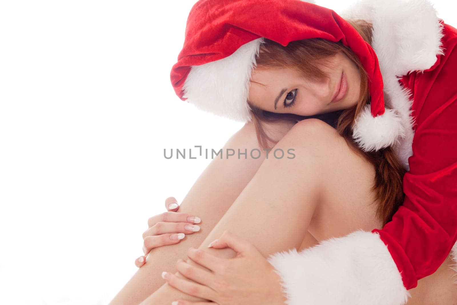 Happy santa girl is presenting herself in the studio