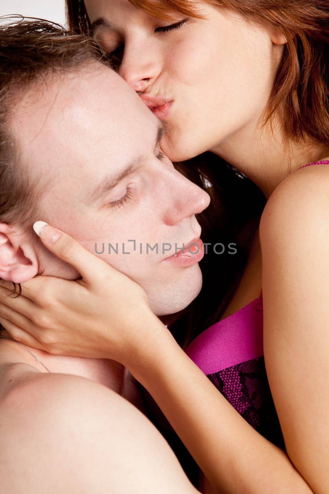 Young couple on a bed with emotions