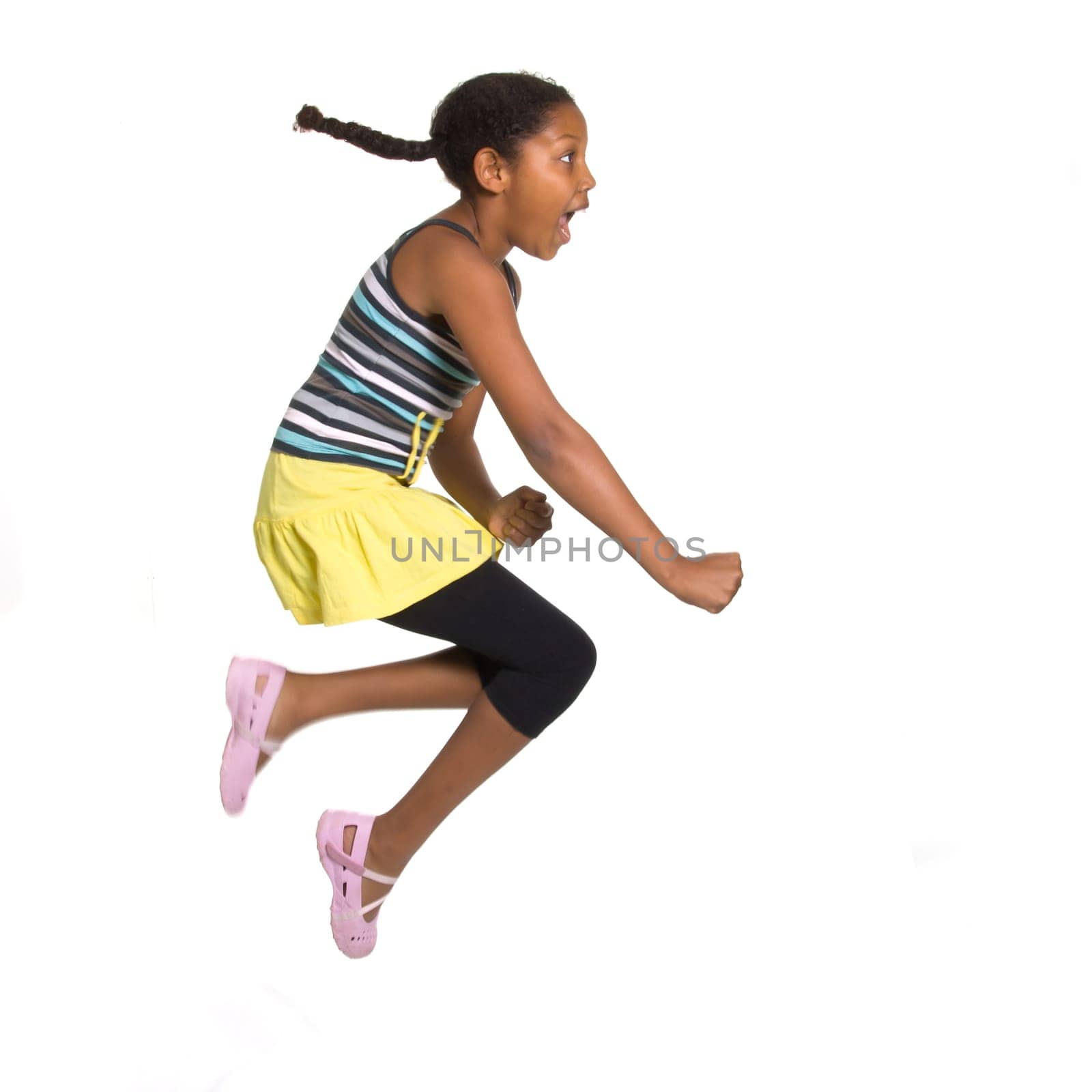 Expressive Young Mixed Race Girl leaping and jumping isolated against white background.