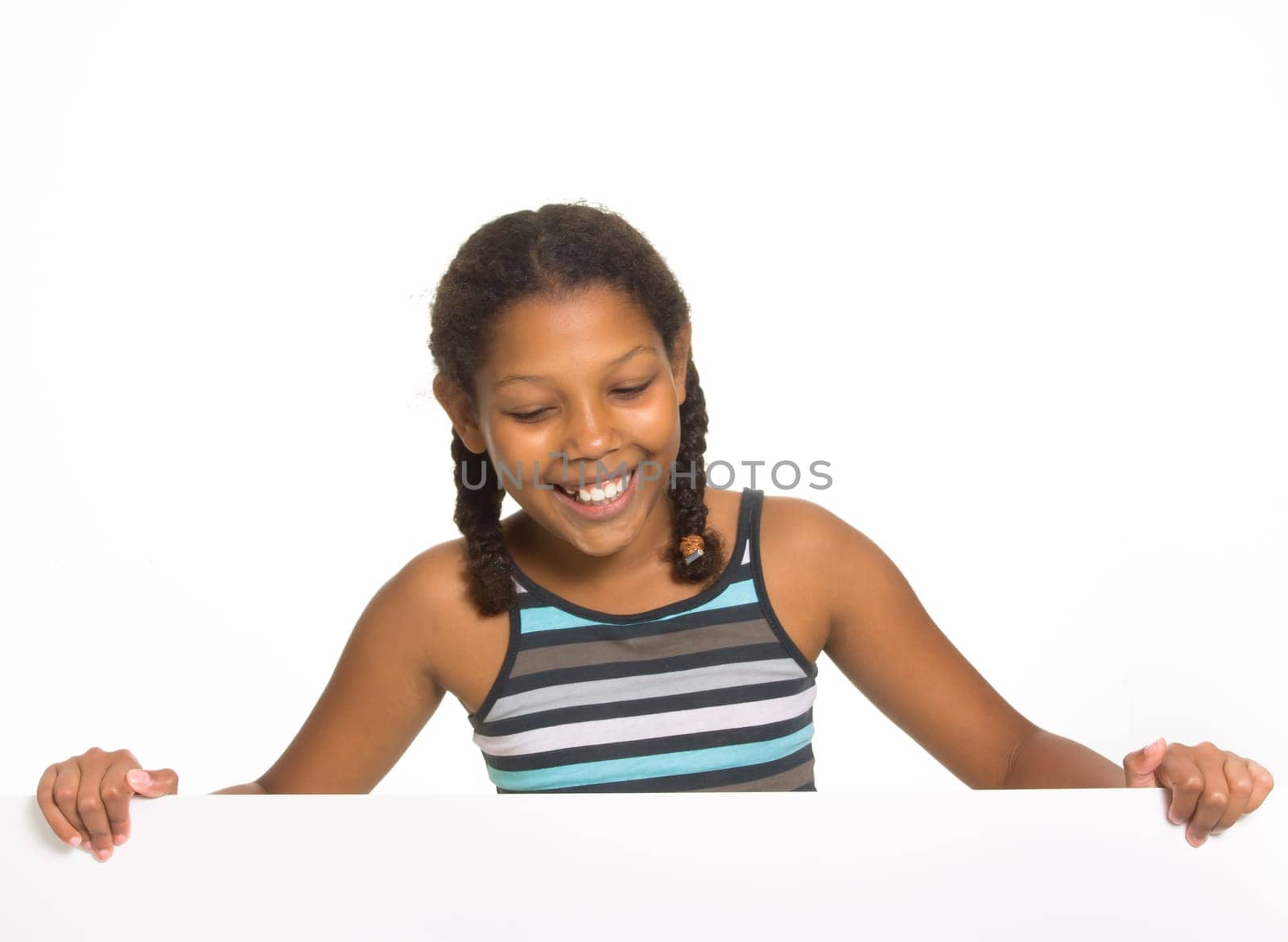 Expressive Young Mixed Race Girl holding board isolated against white background.