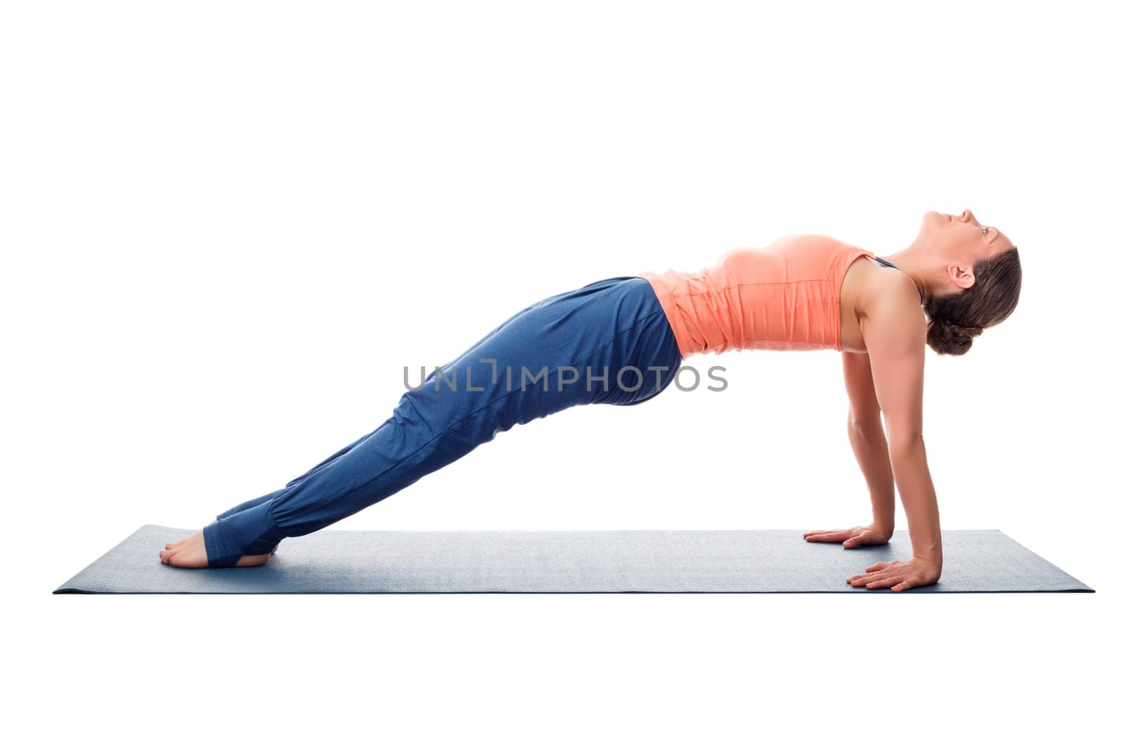 Beautiful sporty fit yogini woman practices yoga asana purvottanasana - upward-facing plank full pose isolated on white background