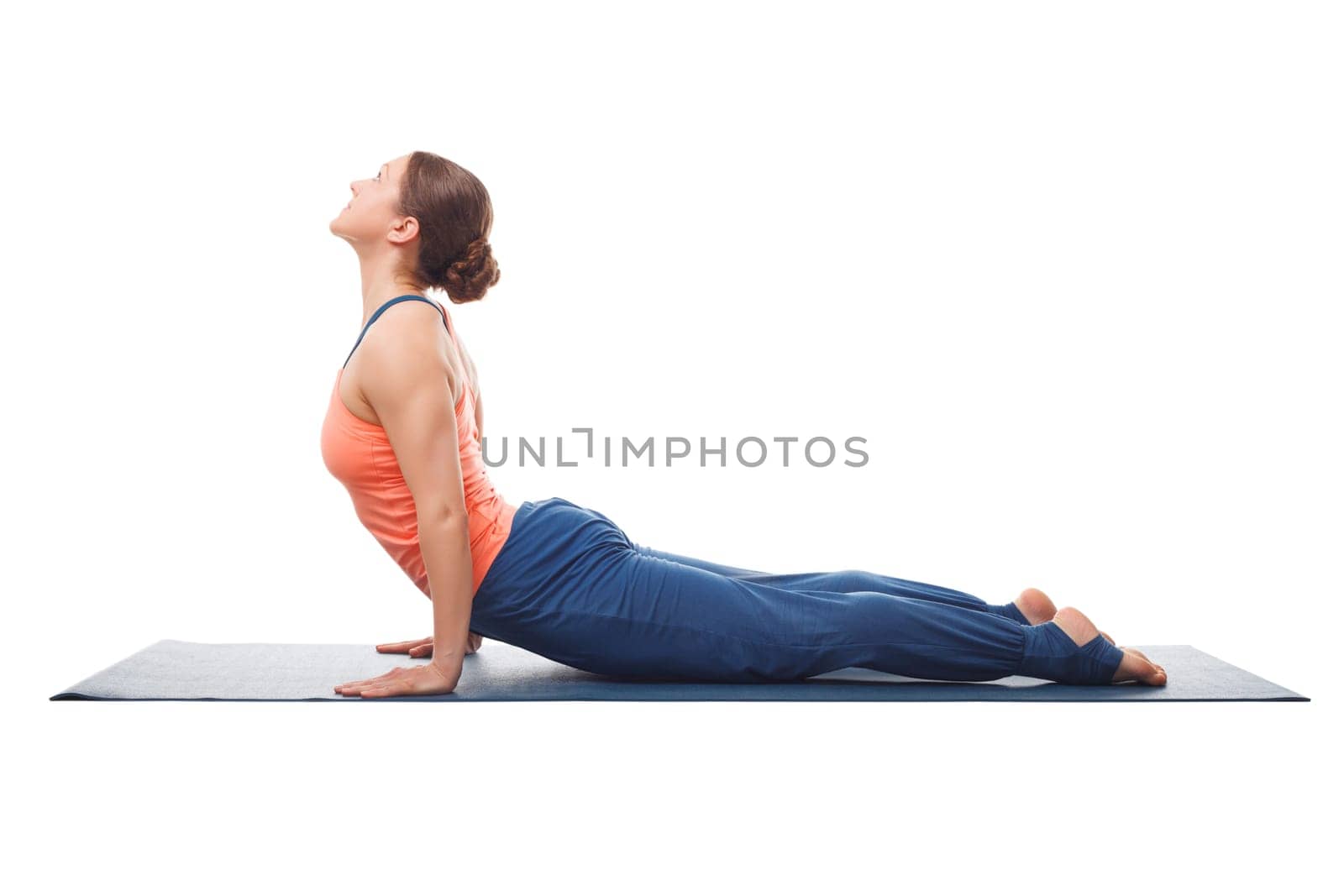 Sporty fit yogini woman practices yoga asana Urdhva mukha svanas by dimol