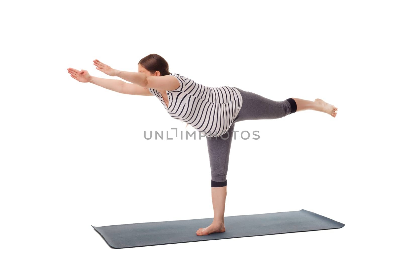 Pregnancy yoga exercise - pregnant woman doing asana virabhadrasana 3 - warrior pose isolated on white background