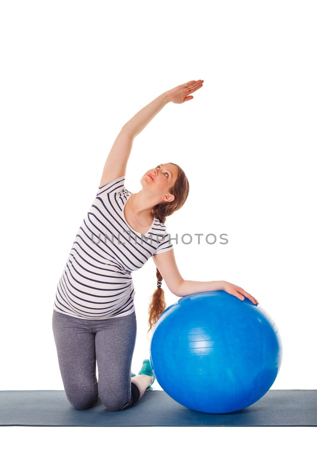 Pregnancy exercise concept - pregnant woman doing exercises with exercise ball isolated on white background