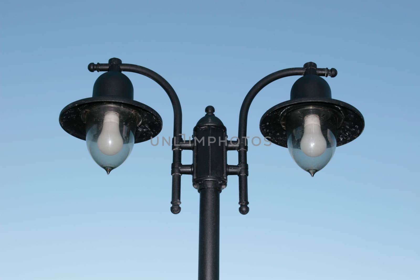 irish street light isolated on blue sky background with clipping path