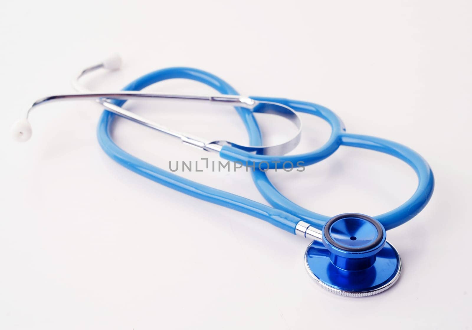 great image of a blue stethoscope on white