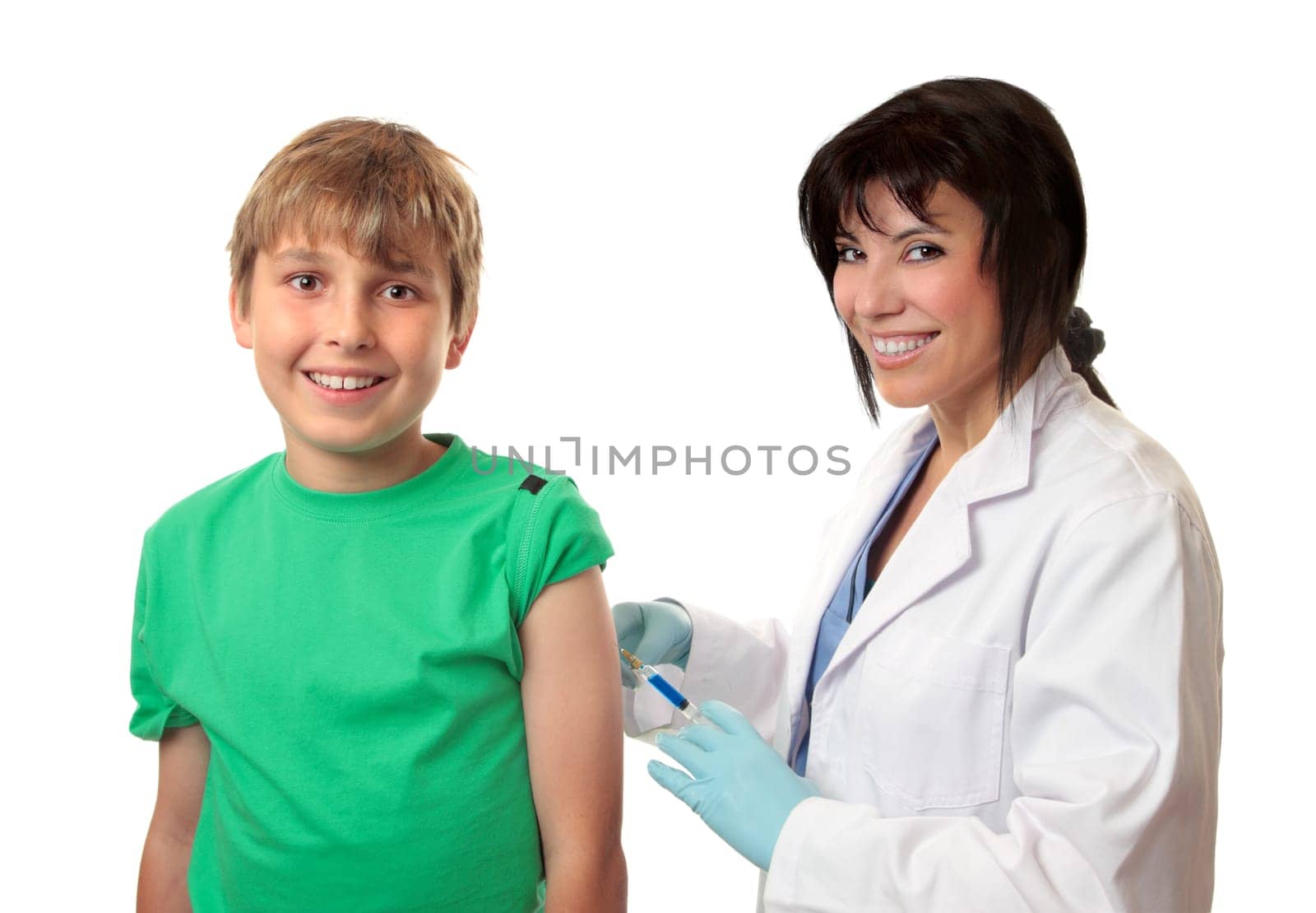 Brave happy boy receives an injection or vaccination from a friendly doctor.