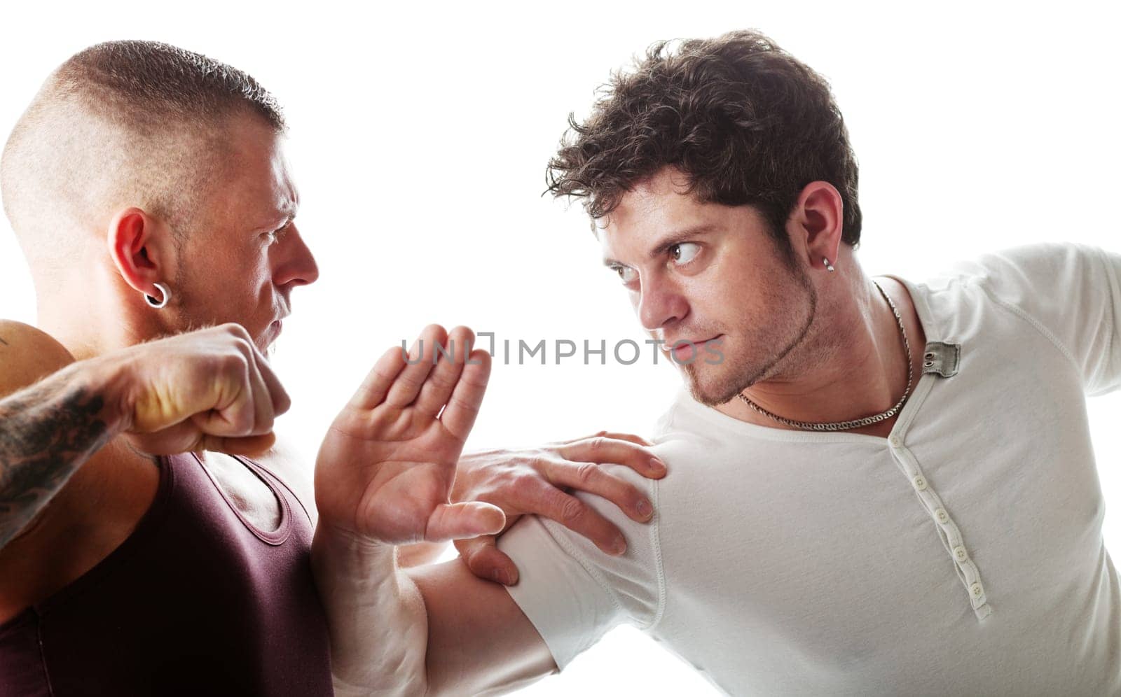 Two muscular men fighting  isolated on white background
