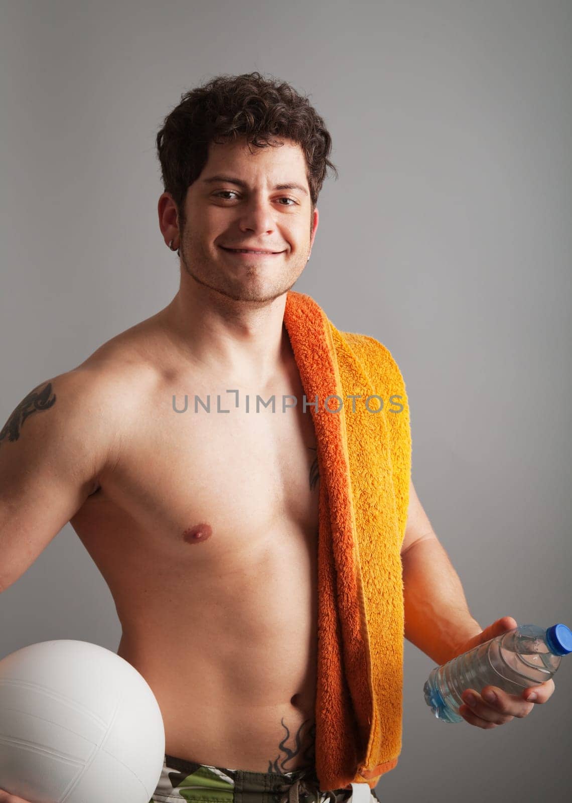 Smiling young man ready for beach entertainment