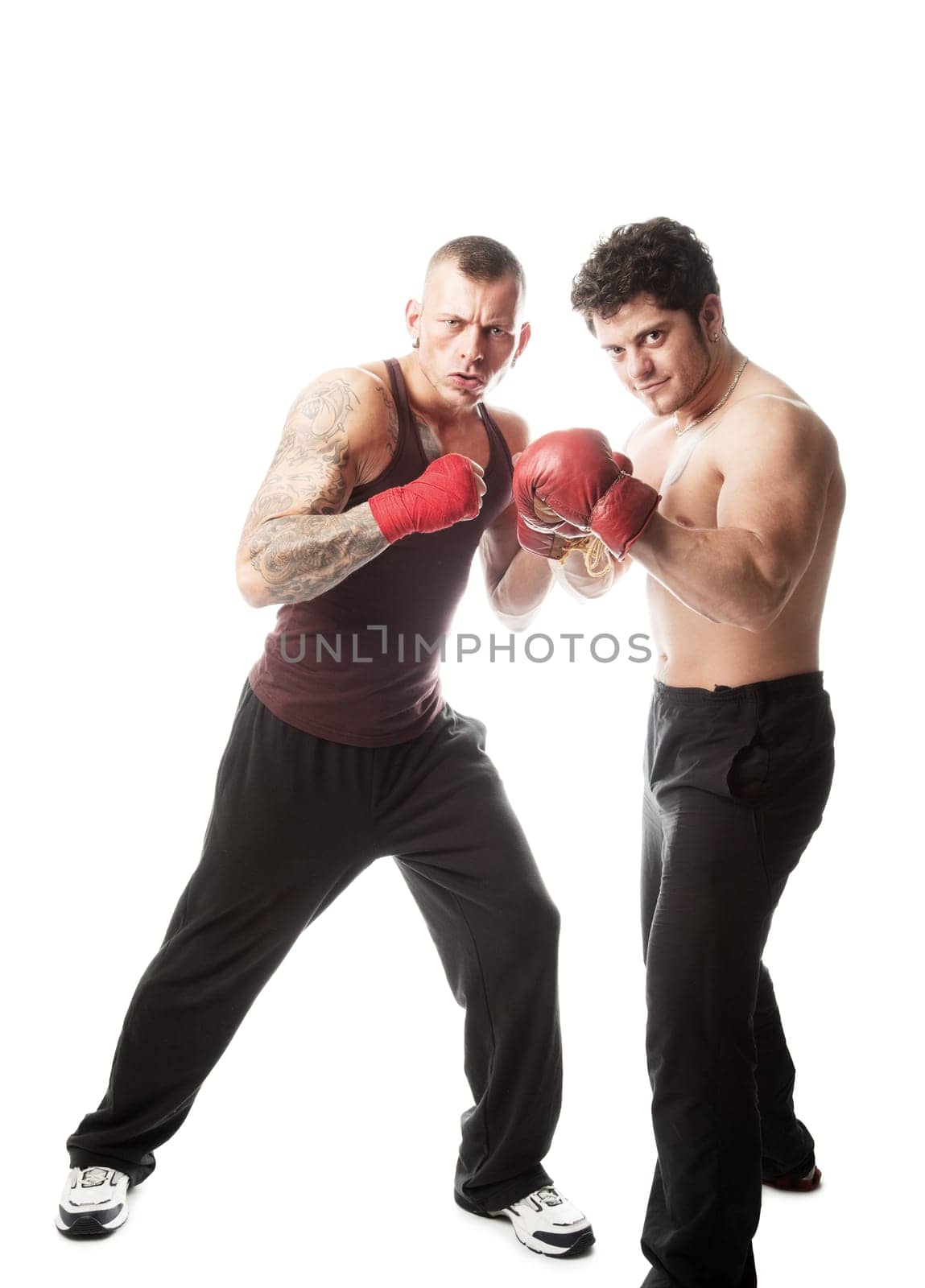 Two muscular sportsmen ready for boxing  isolated on white