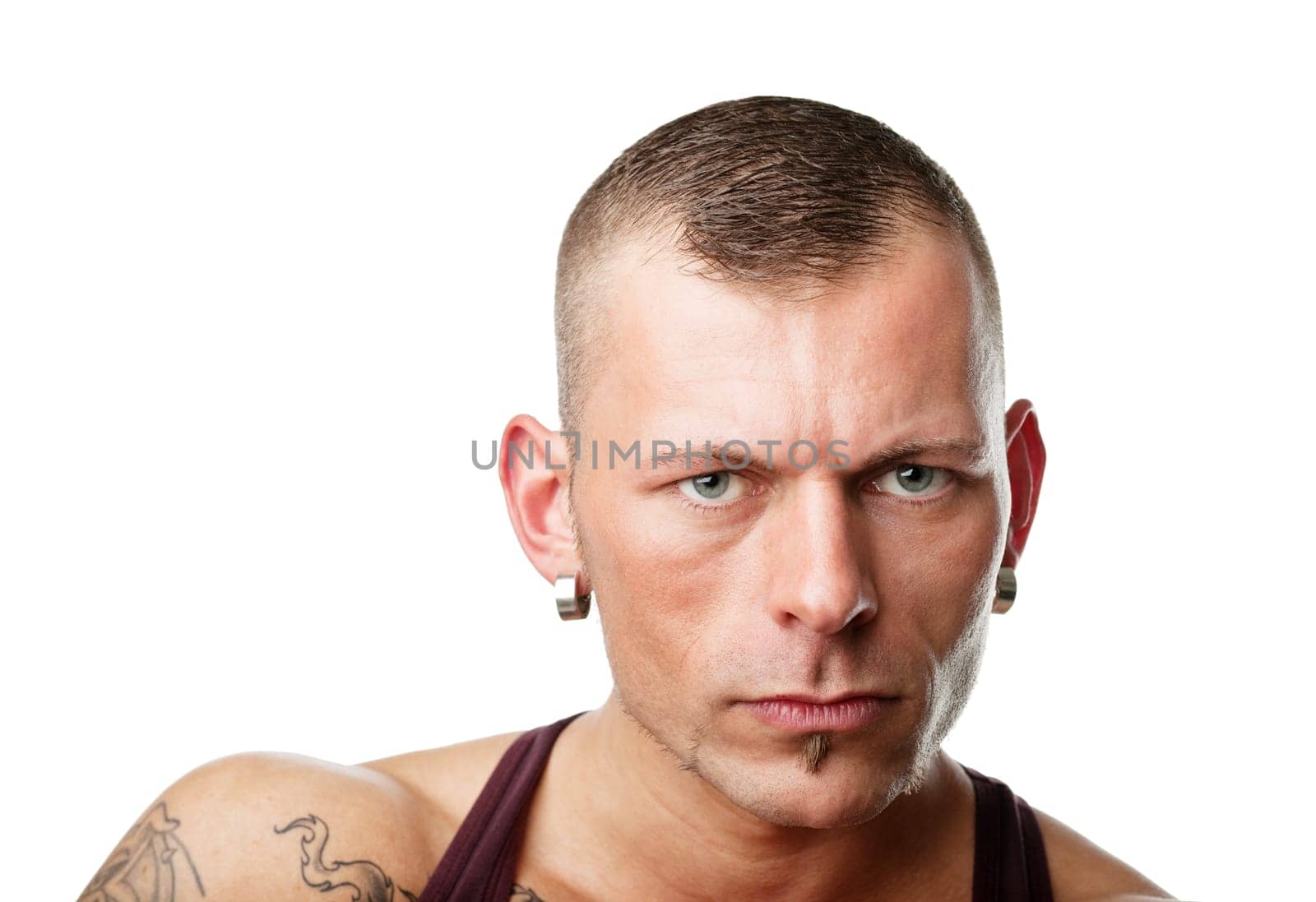Portrait of a young muscular man, isolated on white