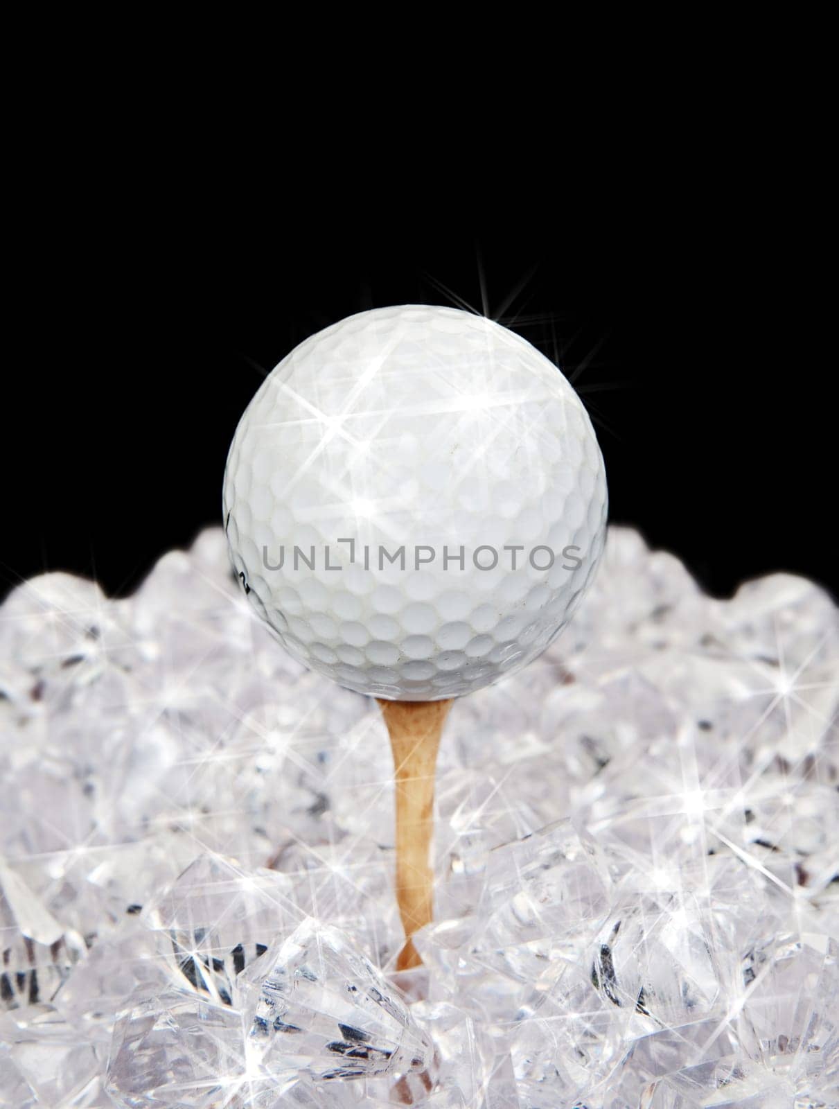 ultimate golf sparkling ball on tee amongst diamonds