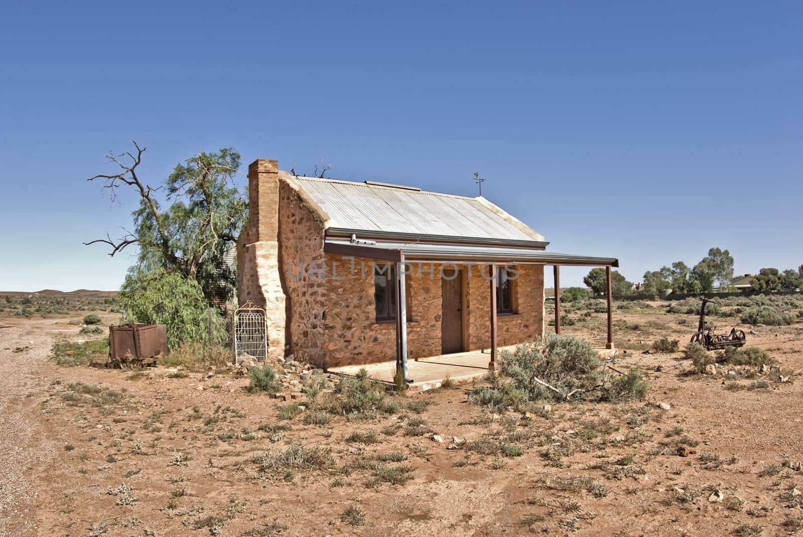 an old building going to ruins in desert at silverton