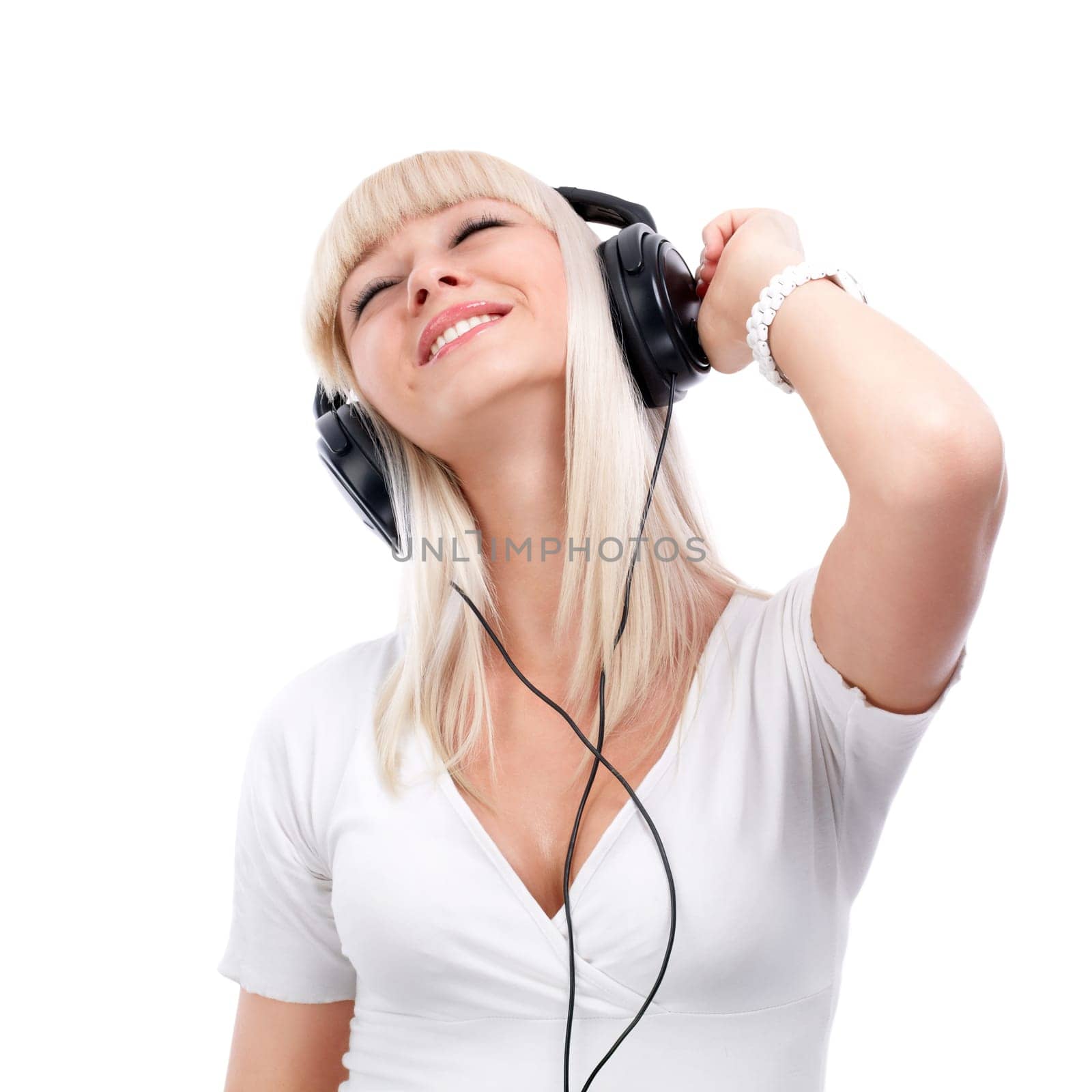Pretty young girl enjoys listening music