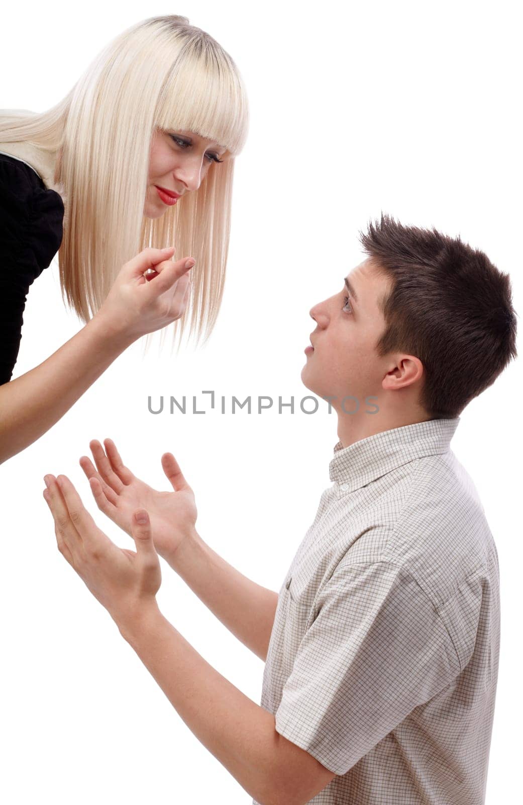 Young woman arguing with her boyfriend who ask for mercy