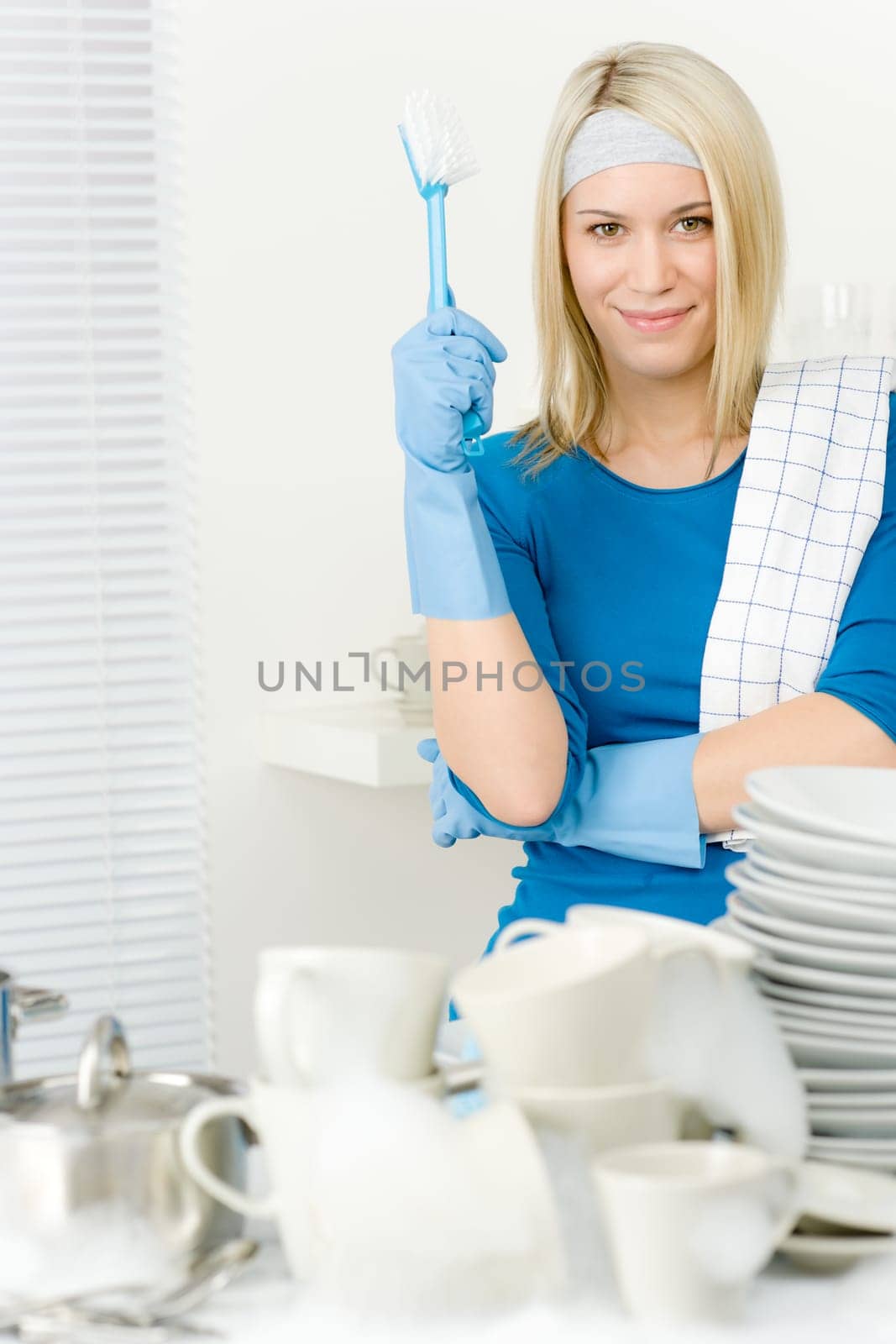 Modern kitchen - happy woman washing dishes, housework