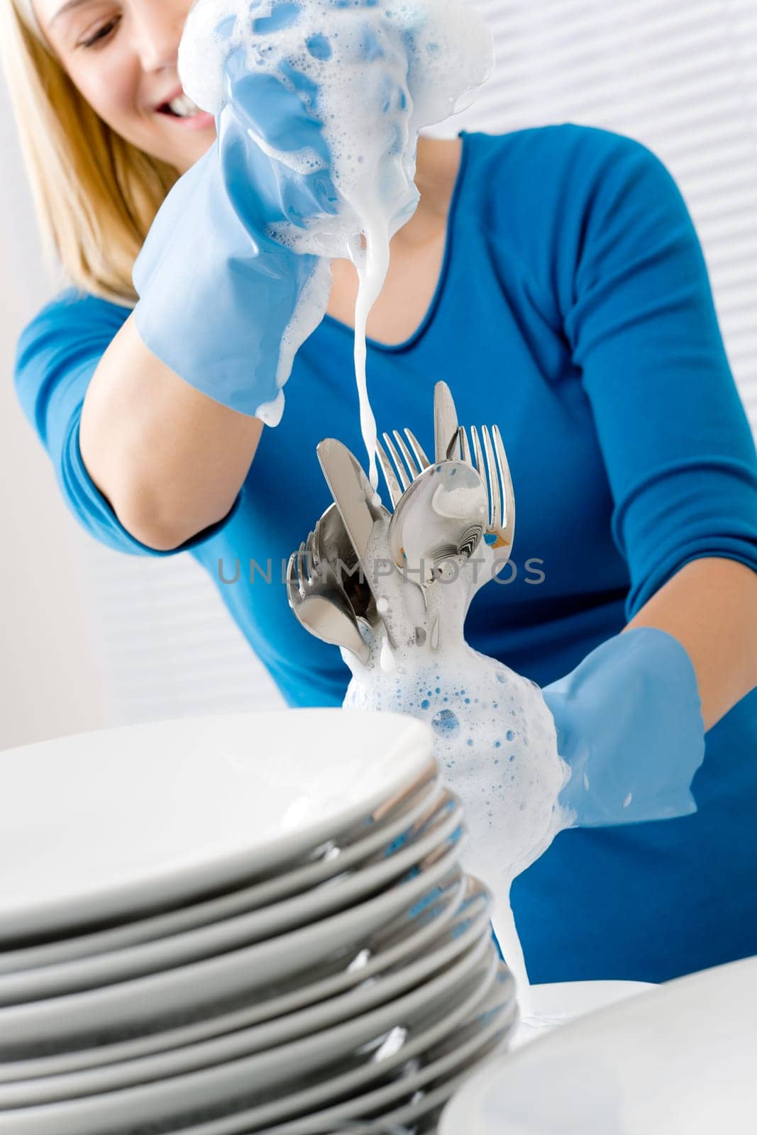 Modern kitchen - happy woman washing dishes, housework