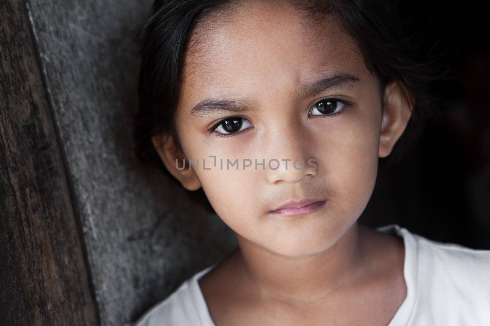 Portrait of a Filipina - young girl from the Philippines against grunge background in natural light