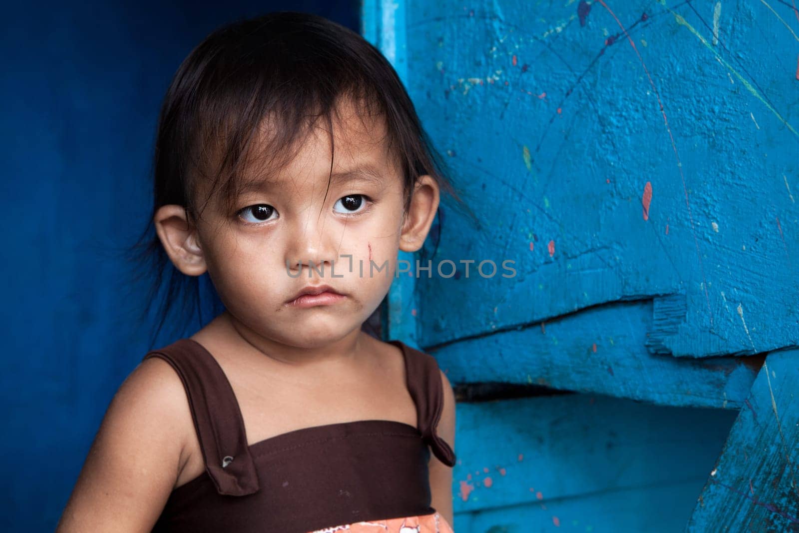 Adorable young girl living in poverty. Manila, Philippines.