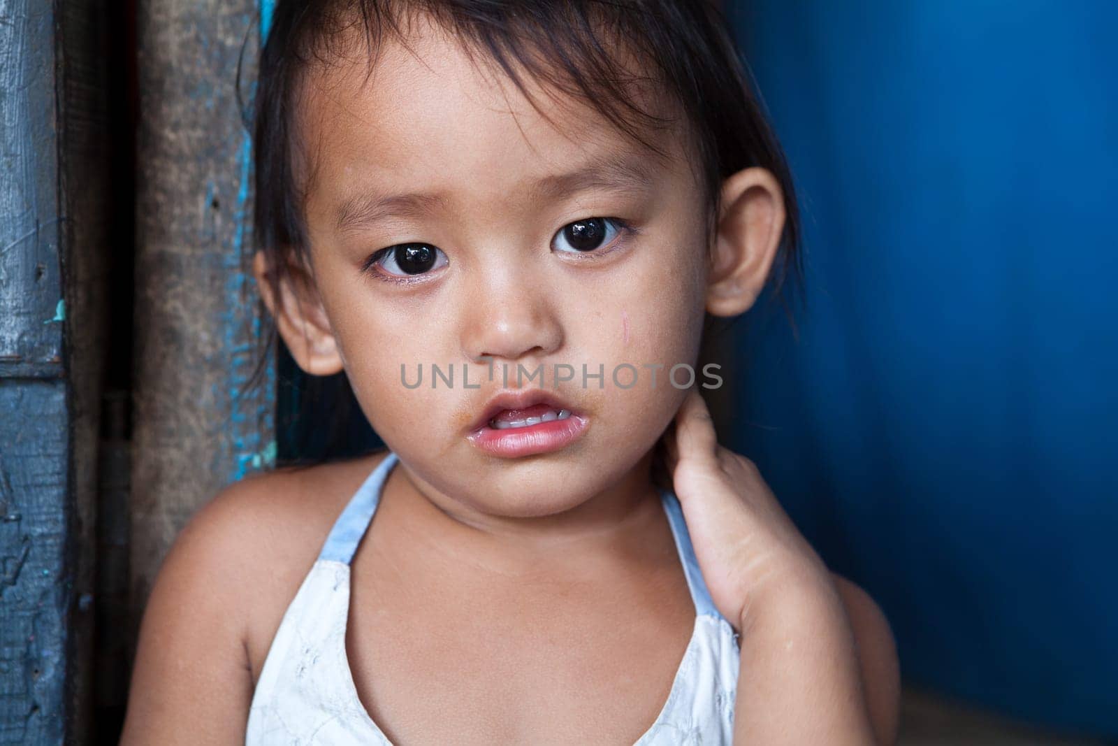Adorable young girl living in poverty. Manila, Philippines.