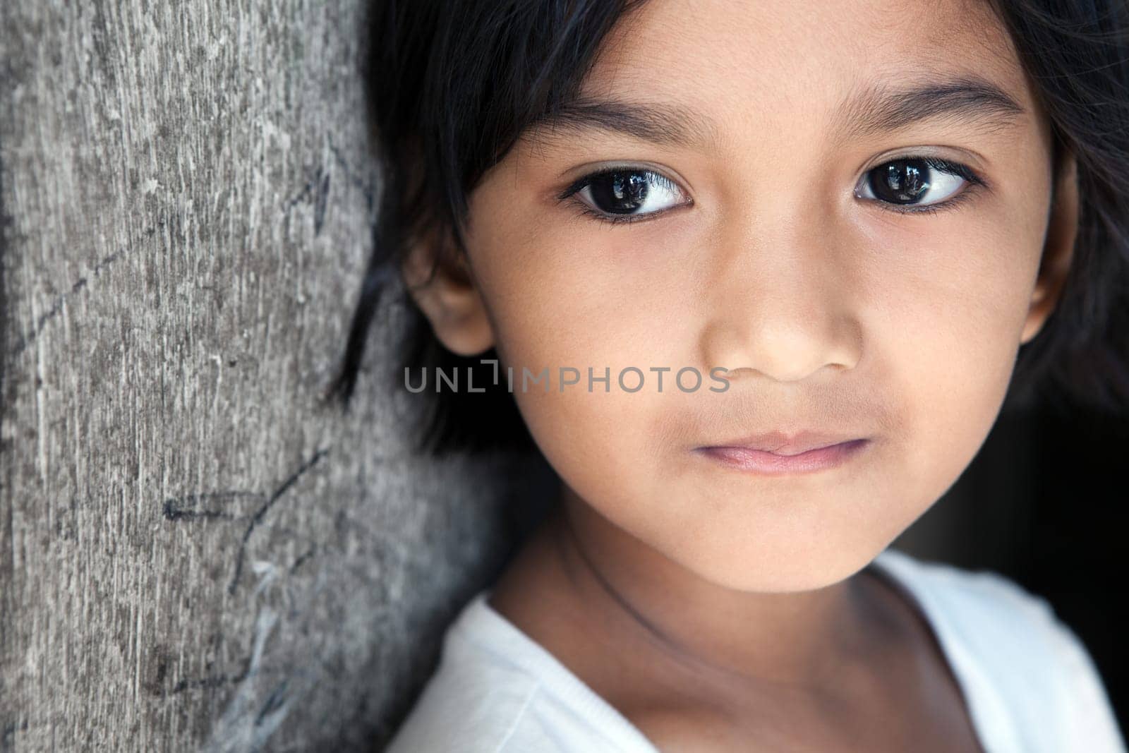 Asian girl portrait - looking to side. Manila, Philippines.