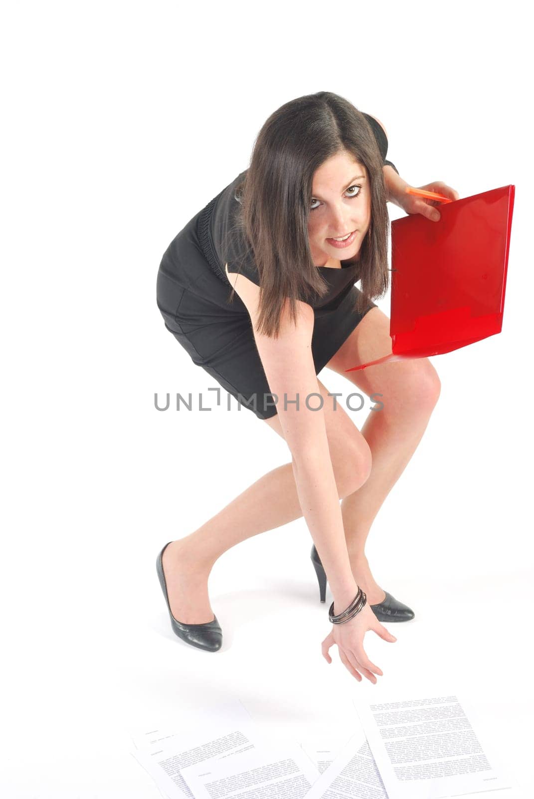woman picking up files