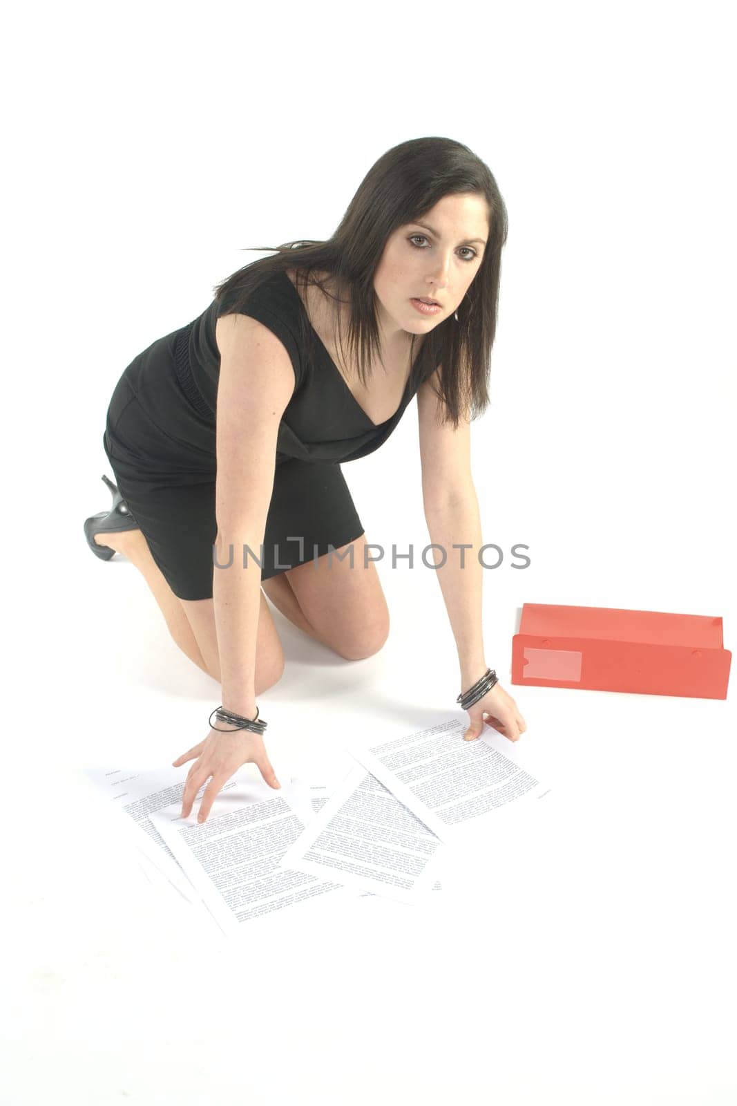 busines woman picking up files
