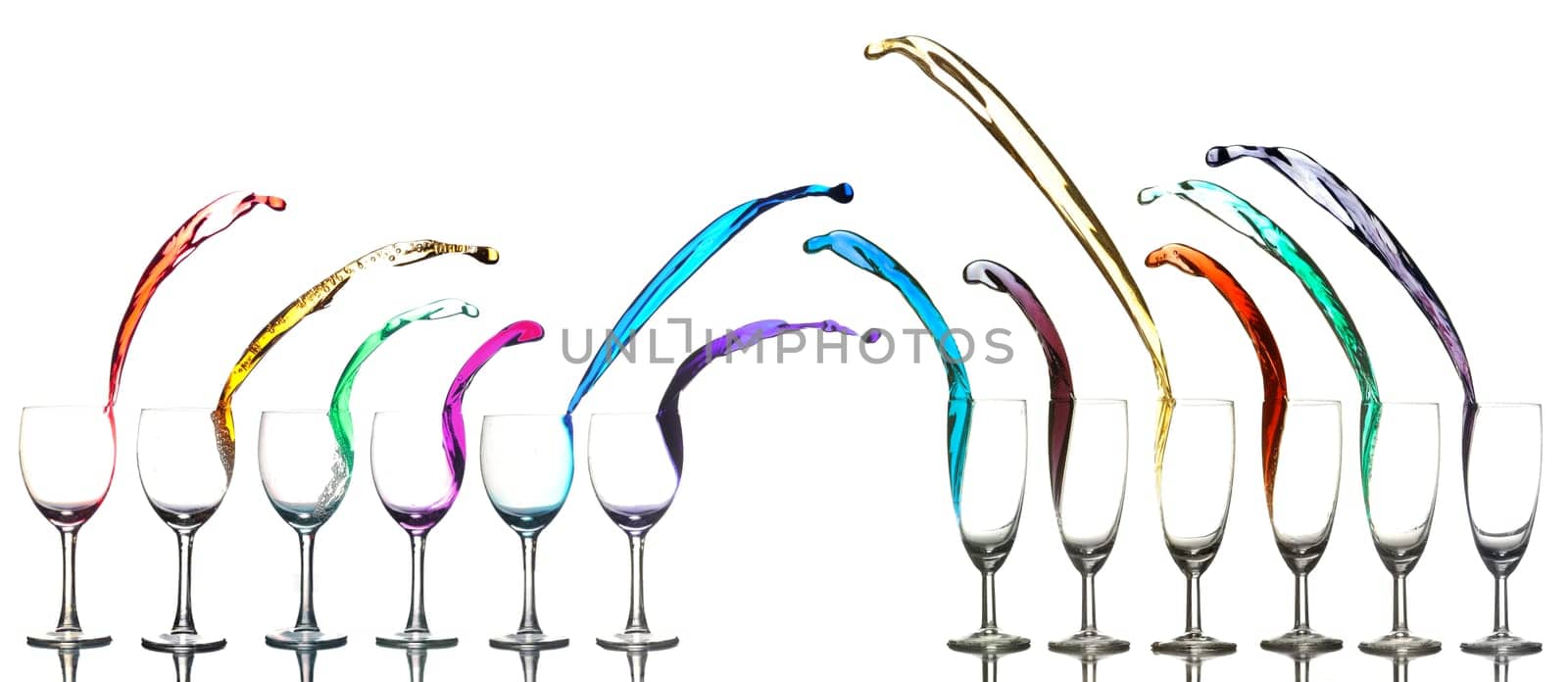 Colored liquid splashing out on a white background