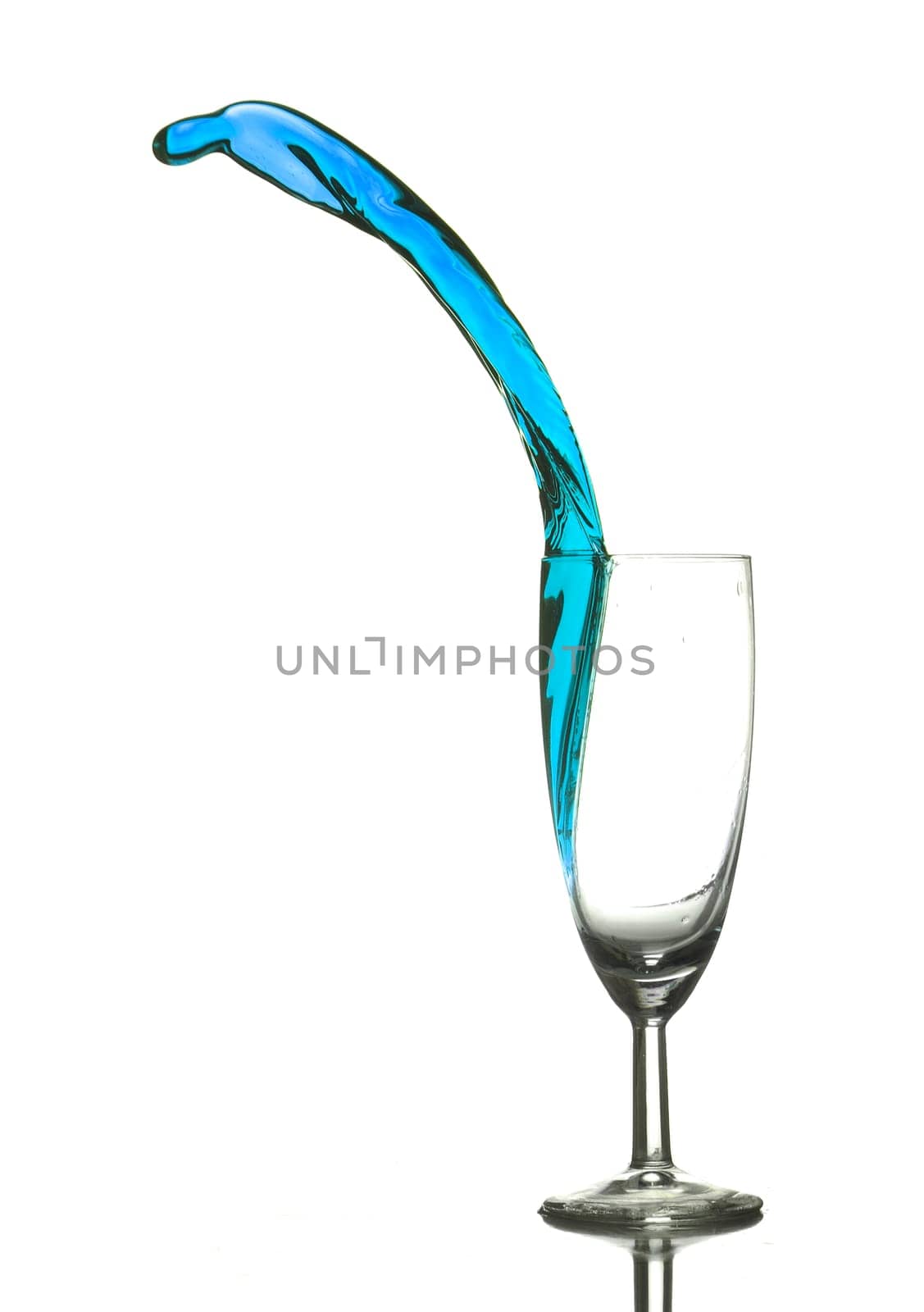 Colored liquid splashing out on a white background