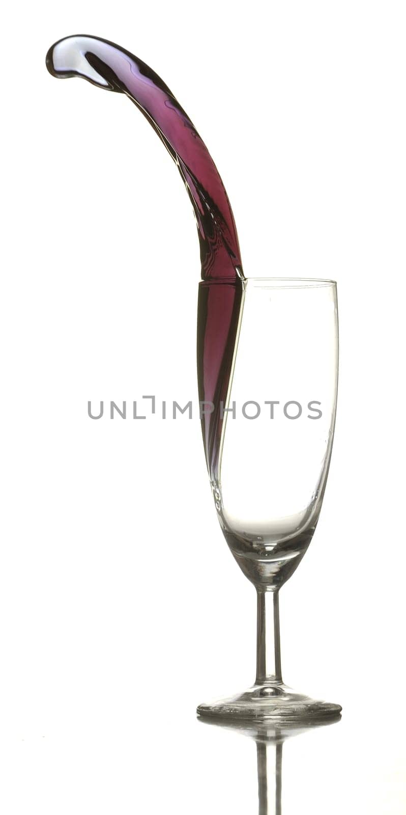 Colored liquid splashing out on a white background