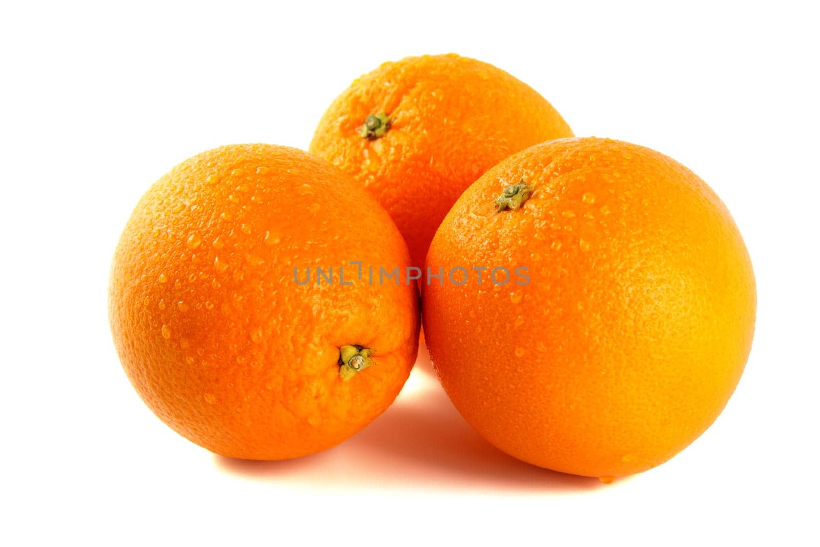 Three oranges isolated against white background