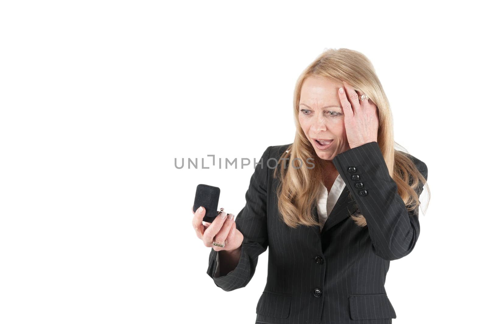 Younger looking woman looking at a ring