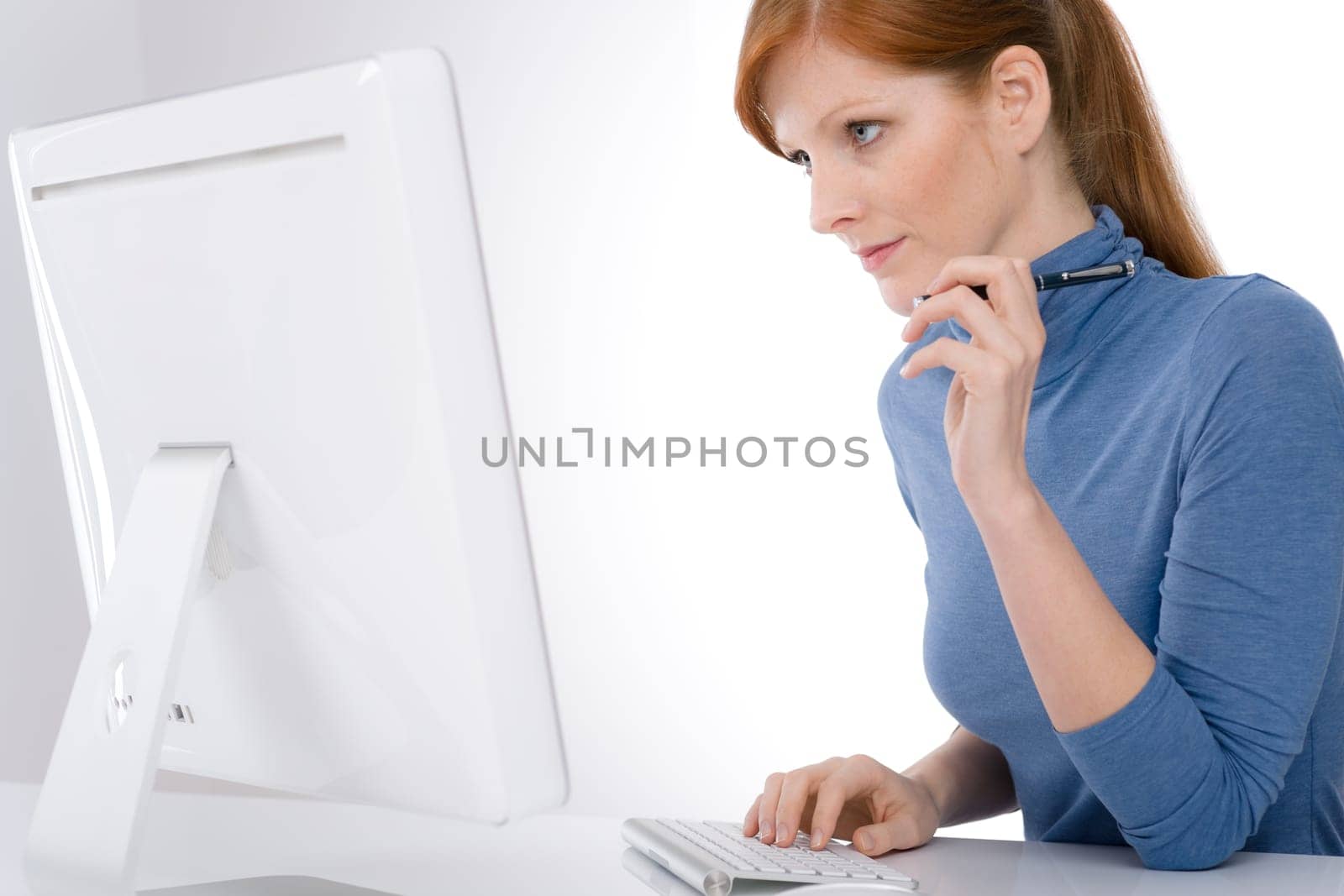 Modern office - young business woman work at computer