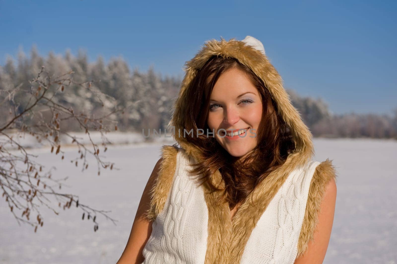 Smiling sexy model in winter nature