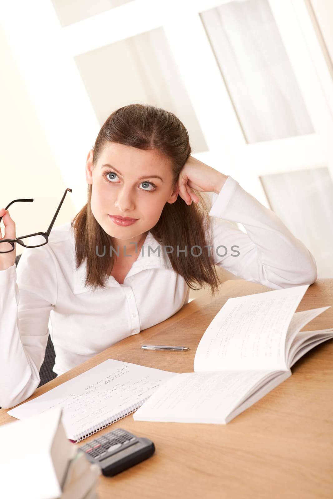 Young brown hair student studying home