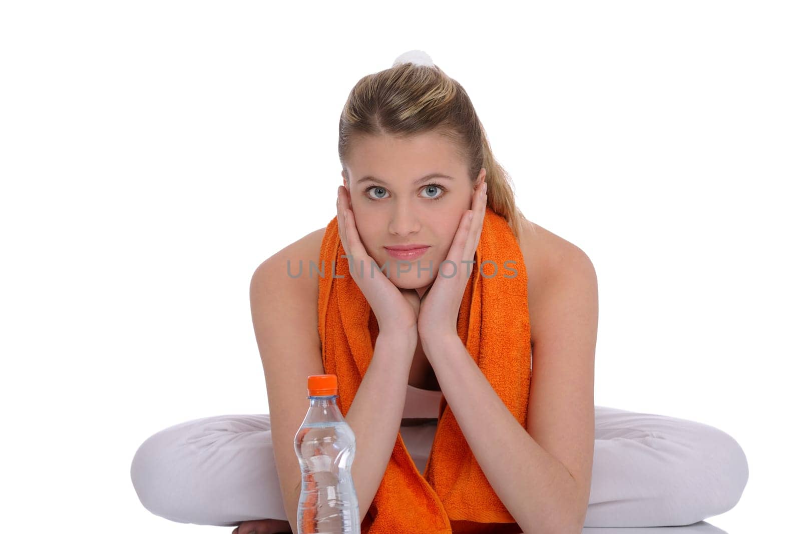 Fitness - Young sportive woman with water and towel on white background