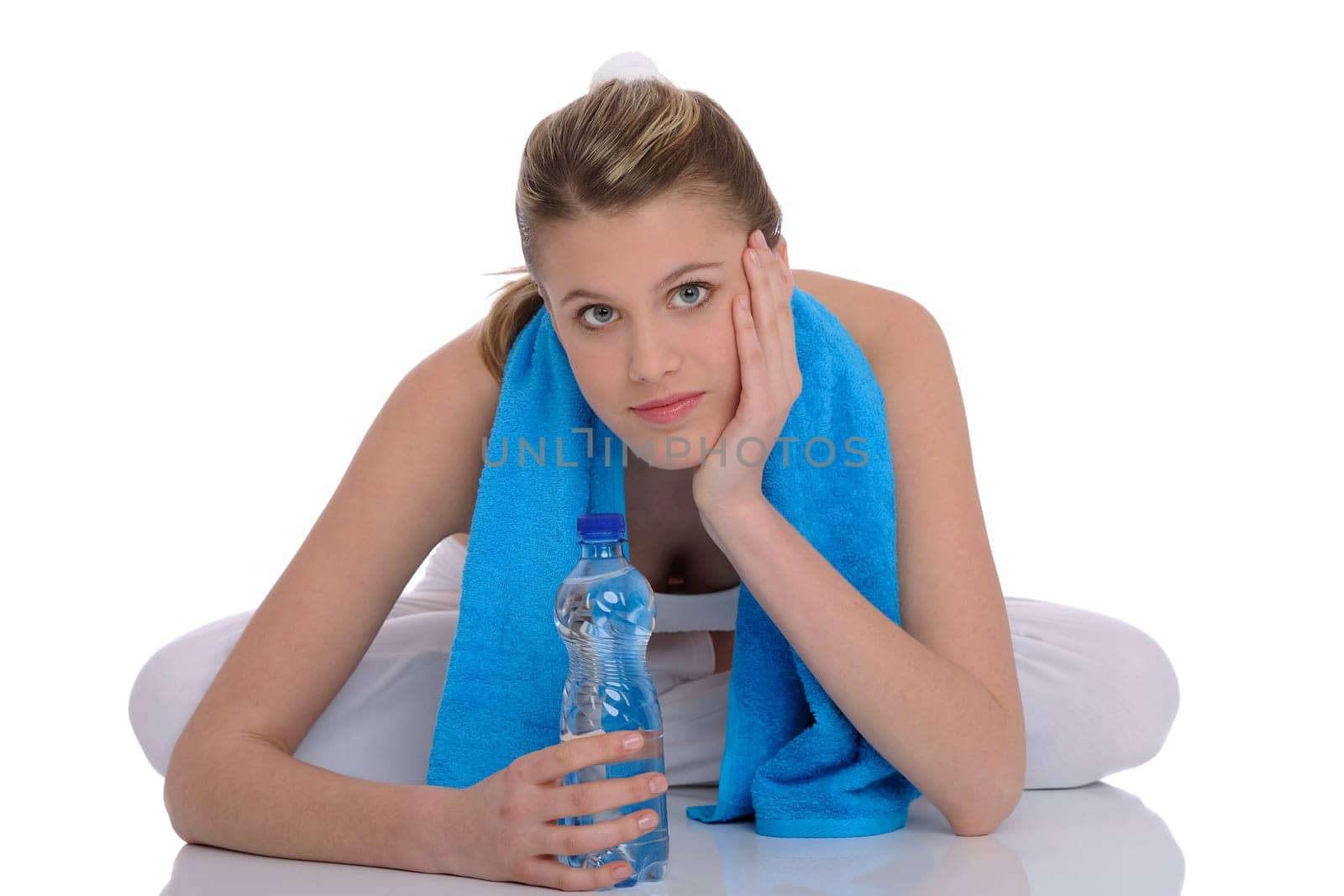 Fitness - Young sportive woman with water and towel on white background
