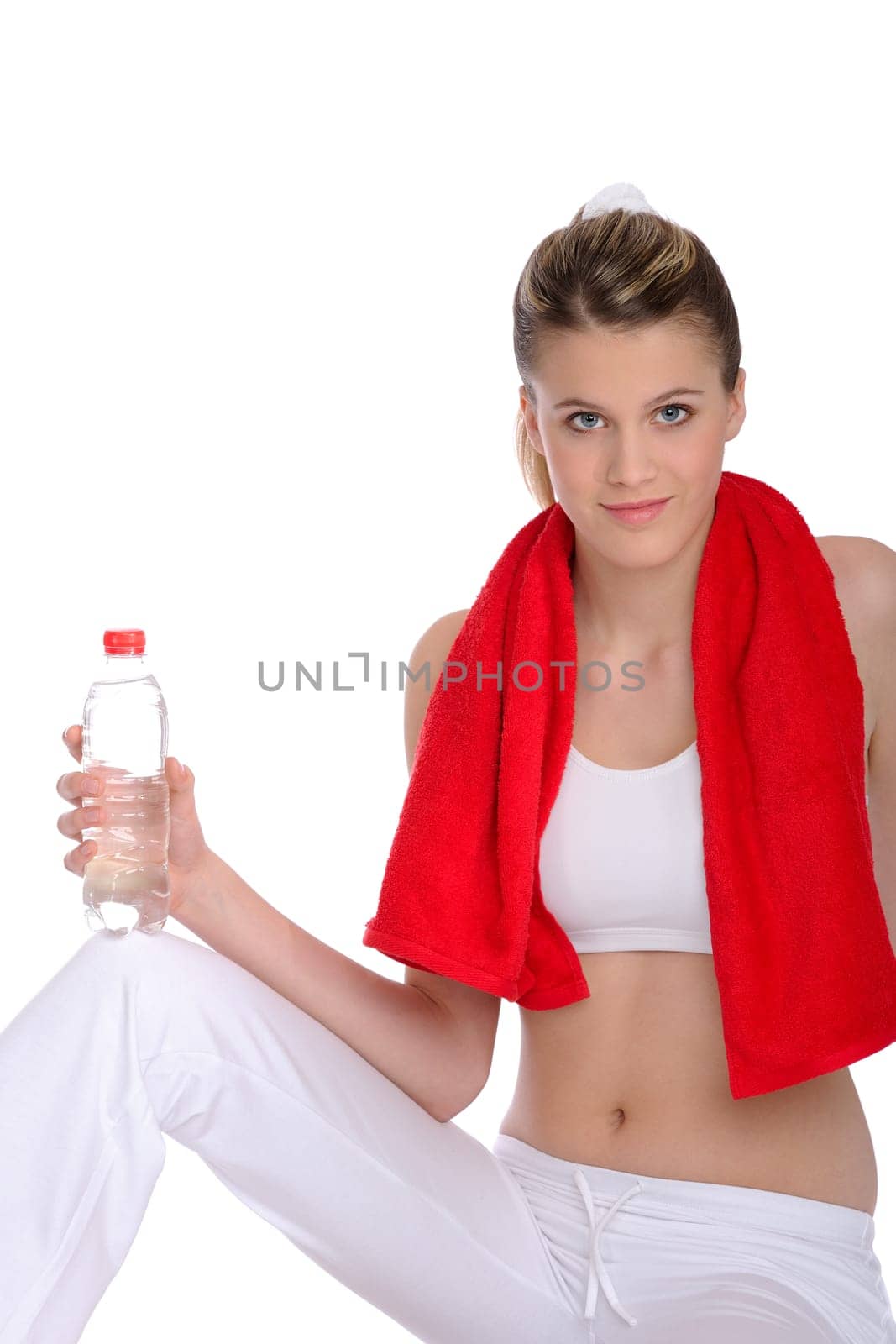 Fitness - Young sportive woman with water and towel on white background