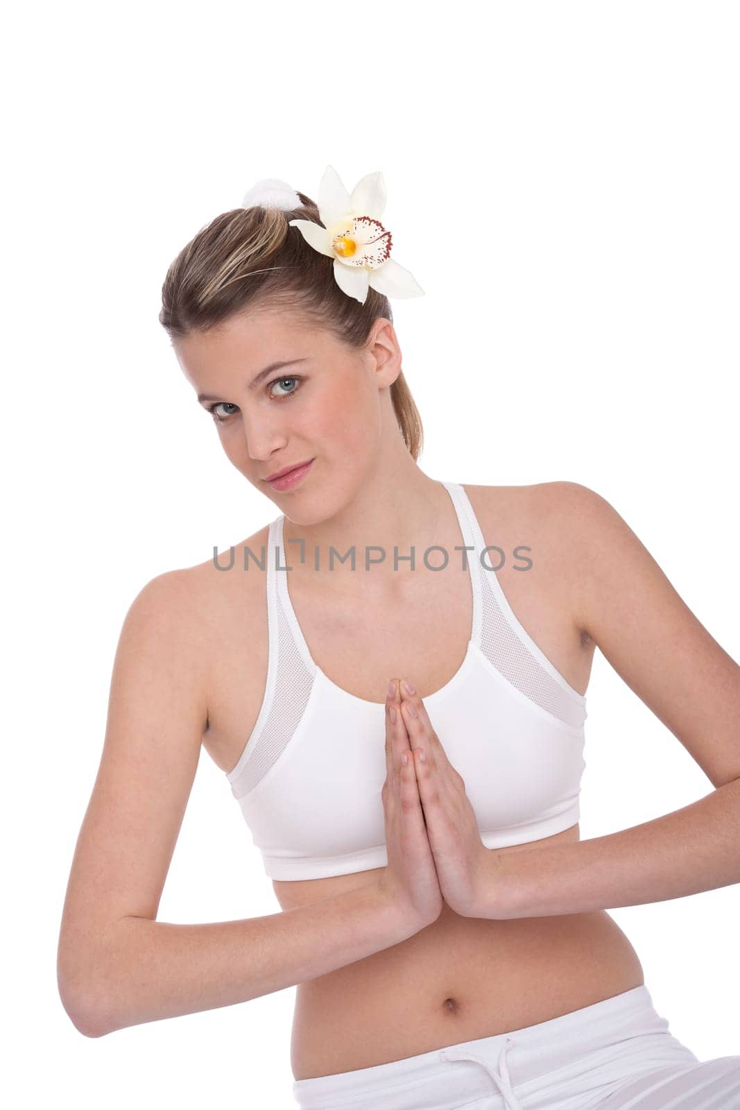 Fitness - Young woman in yoga position on white background relaxing