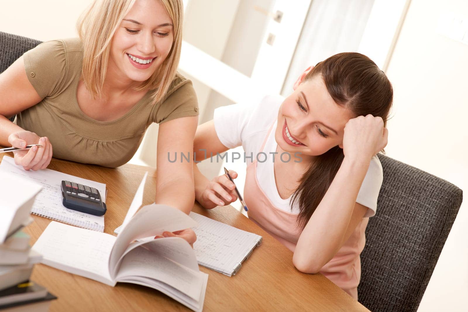 Two girls studying together