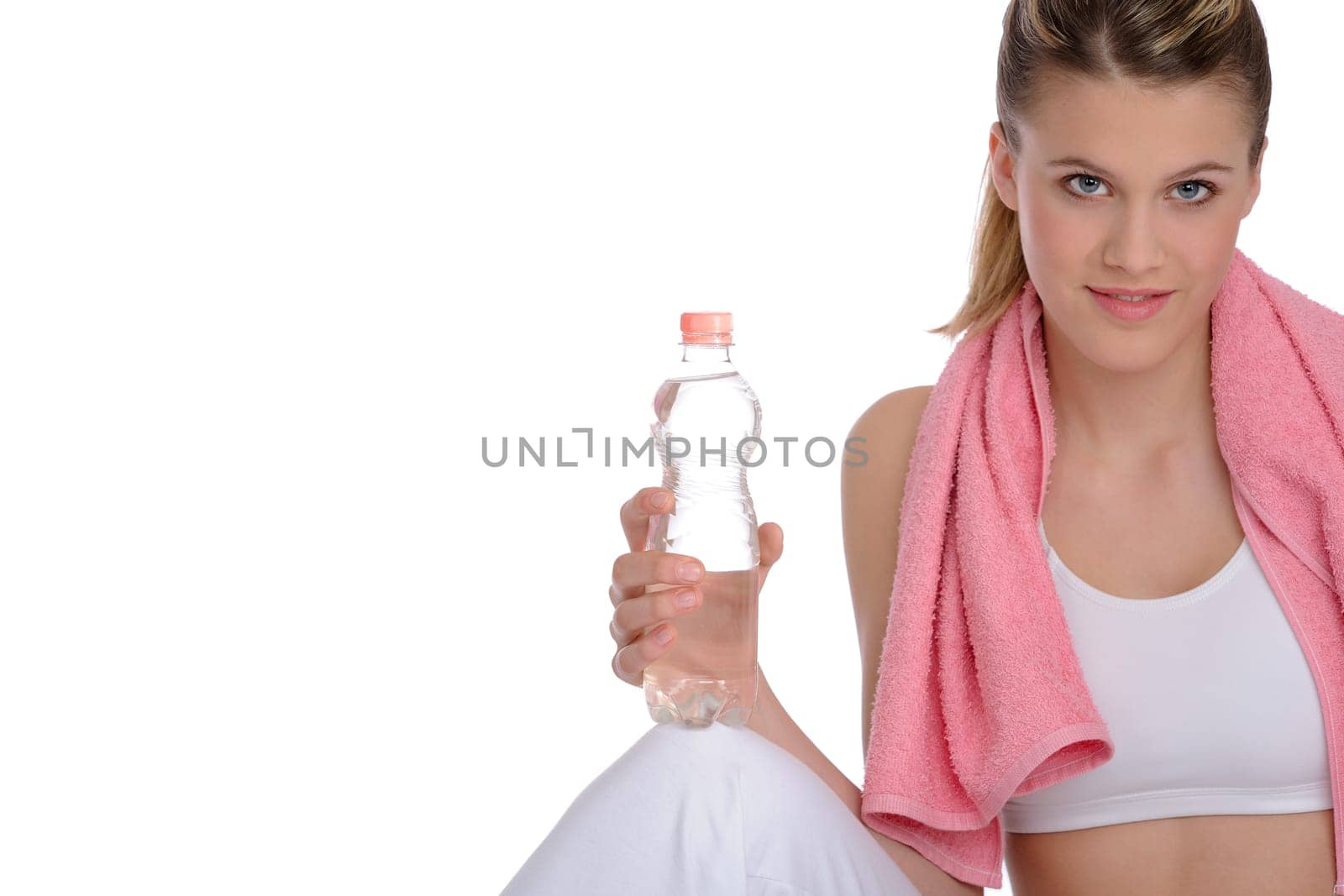 Fitness - Young sportive woman with water and towel on white background
