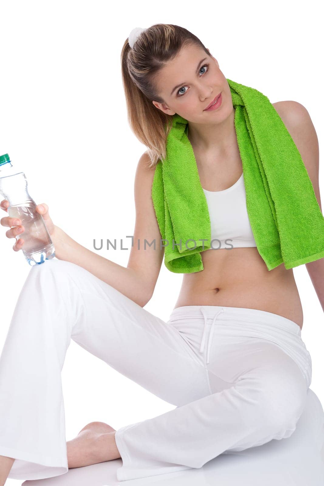 Fitness - Young sportive woman with water and towel on white background