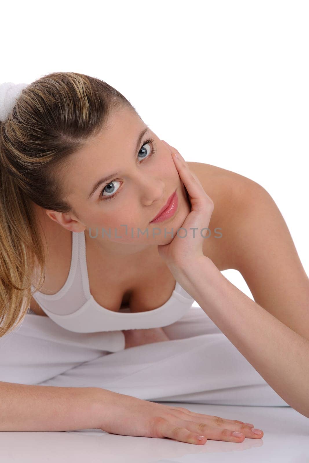 Fitness - young sportive woman on white wearing fitness clothes