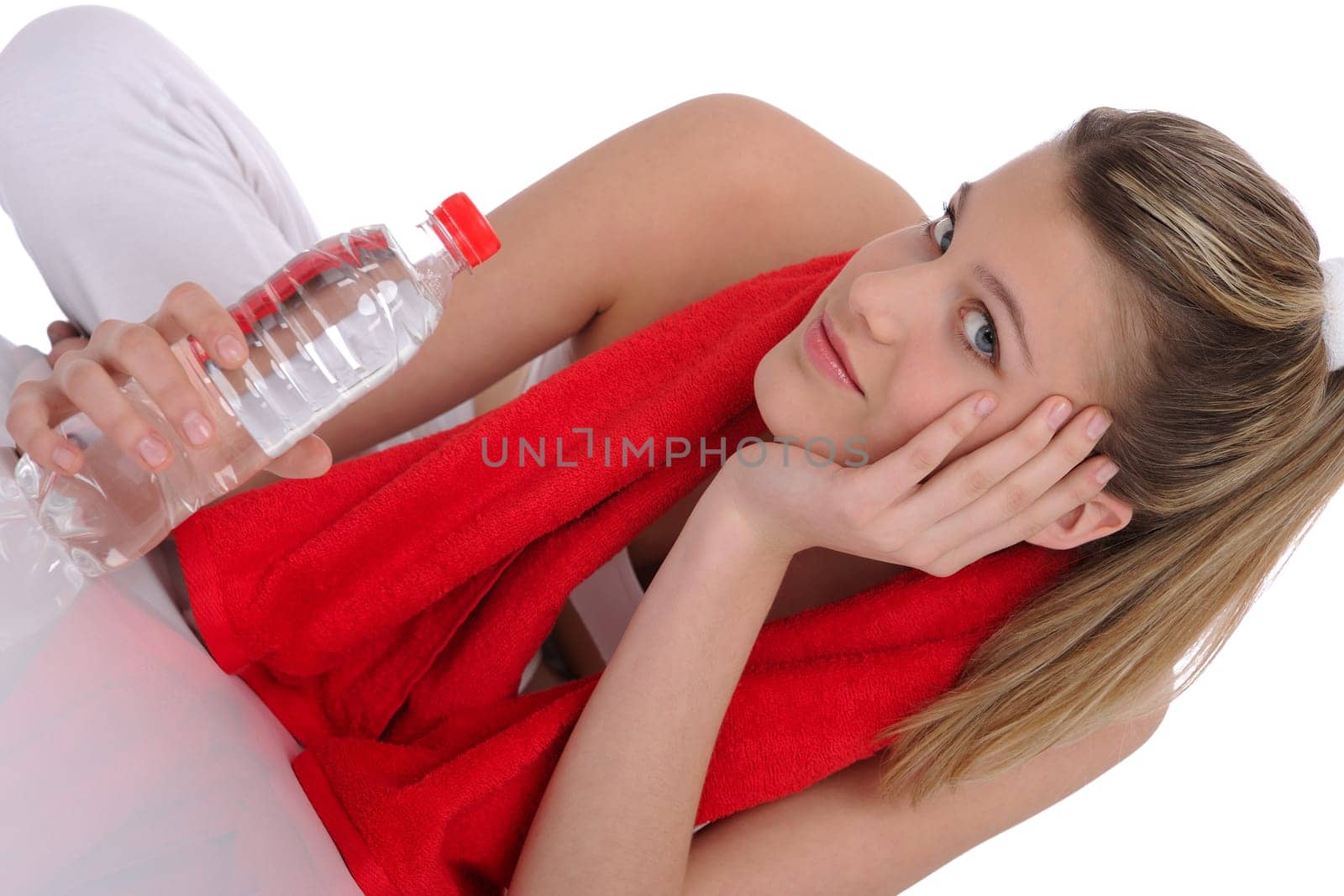 Fitness - Young sportive woman with water and towel on white background