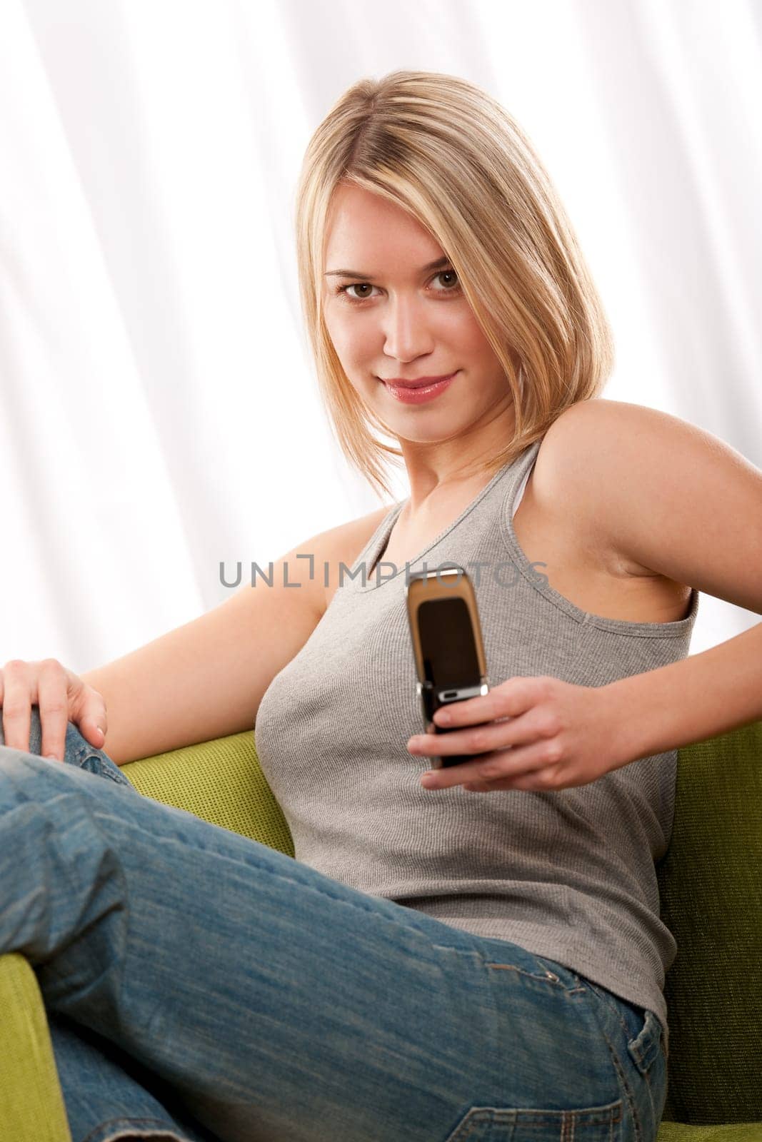 Blond teenage girl with mobile phone