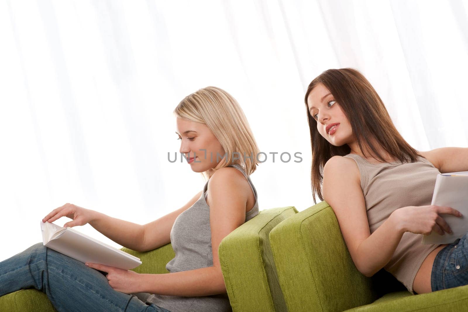 Two girls reading books