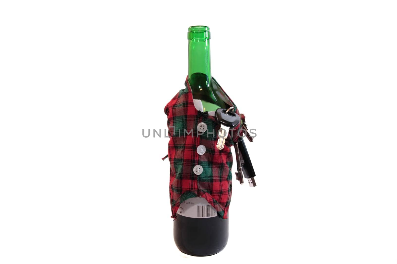 bottle dressed in jacket warmer with keys and alcohol on white background depicting drunk driving and addictions can kill