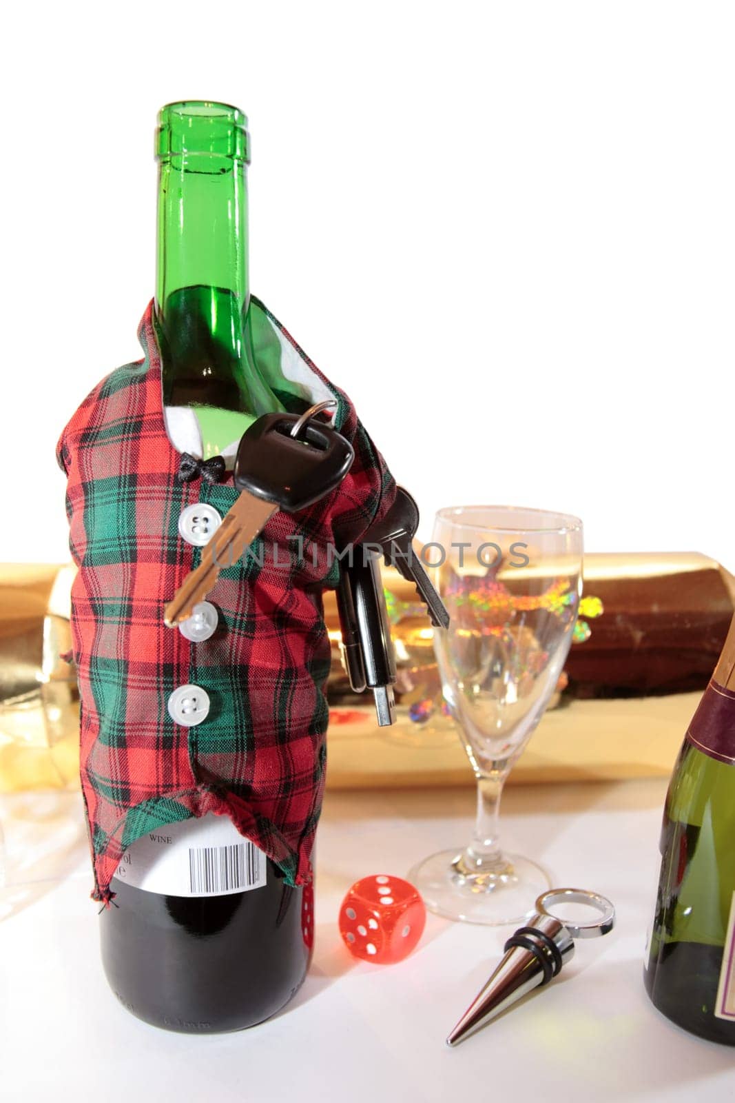 bottle dressed in jacket warmer with keys as arms on white background depicting drunk driving