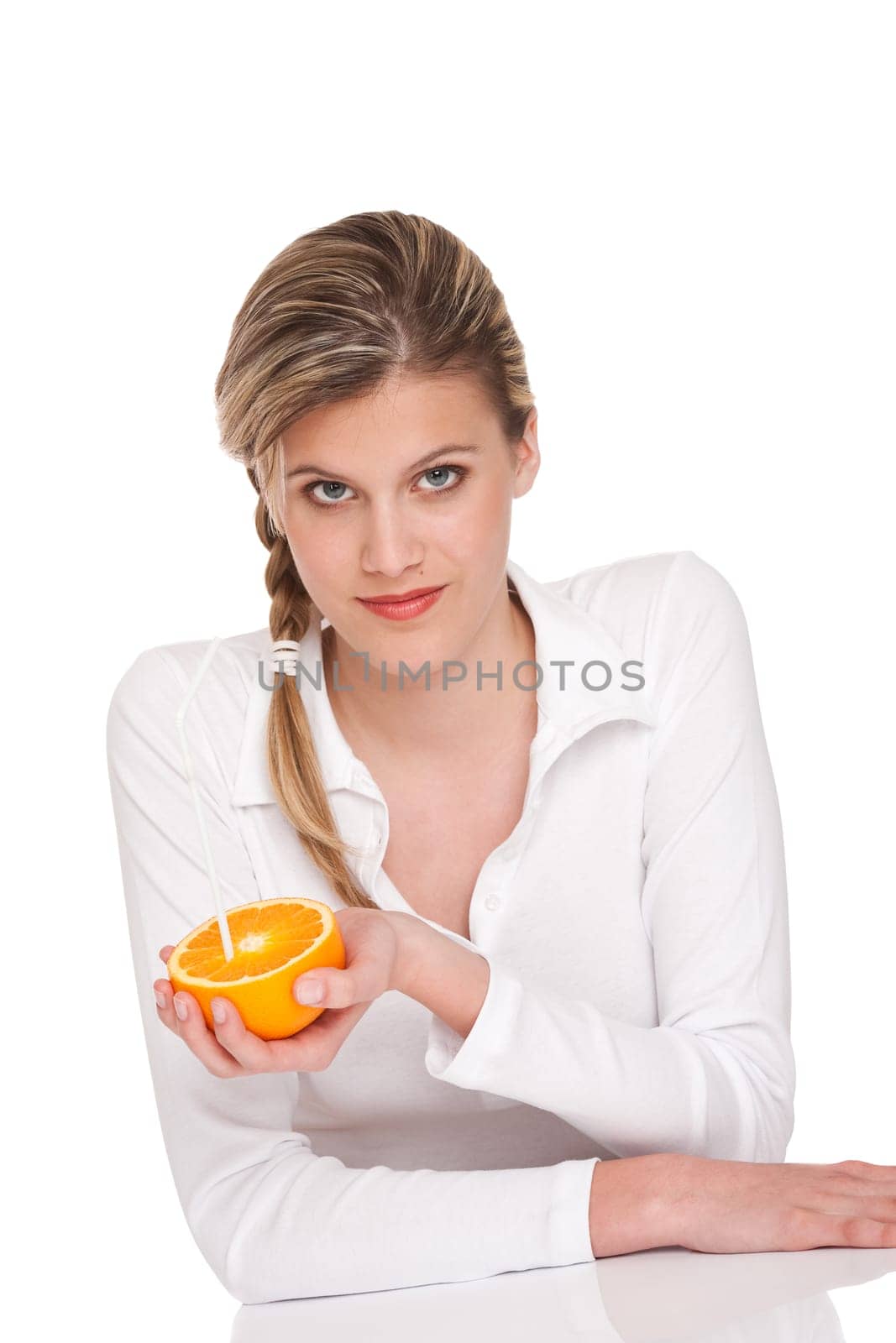 Woman holding orange on white background