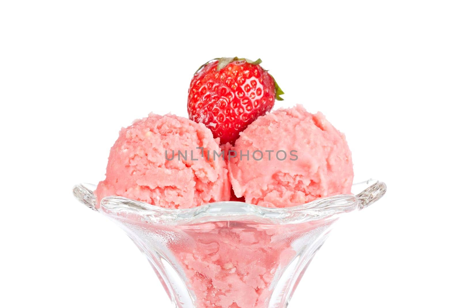Delicious strawberry ice cream in glass bowl isolated on white background. Shallow depth of field